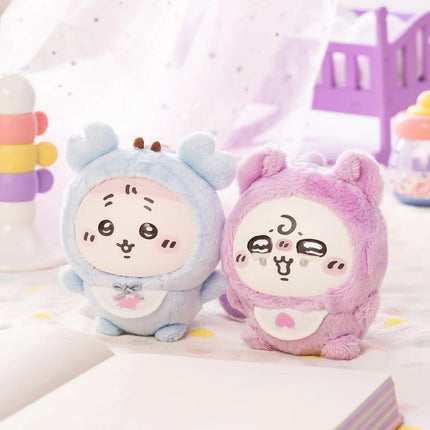 Light blue and purple baby plush characters with hooded faces