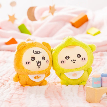 Two hooded plush keychains, one orange and one green, with cute embroidered faces