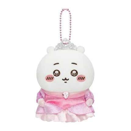 White plush mascot keychain with pink ruffled dress and bead crown, front view.
