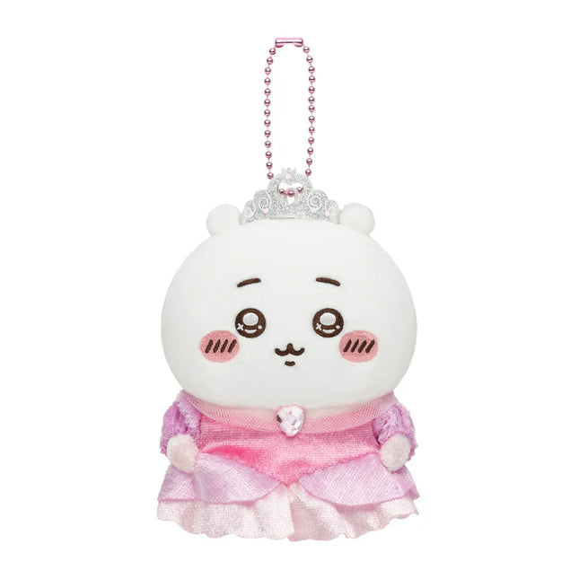White plush mascot keychain with pink ruffled dress and bead crown, front view.