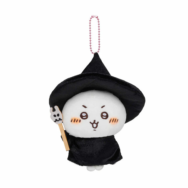 Plush mascot keychain with black witch hat and robe, holding a small wooden wand