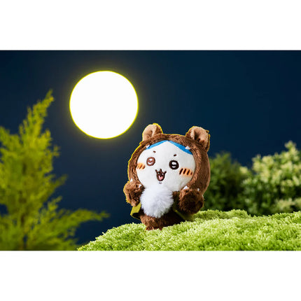 Plush mascot in a brown animal hood costume with white face fur and rounded ears