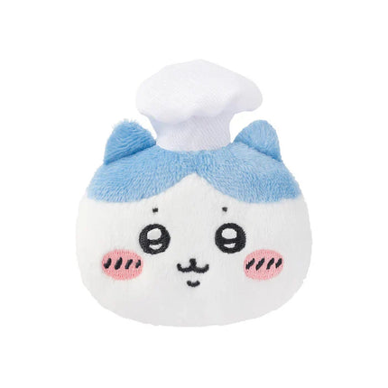 Blue-and-white plush chef face badge with chef hat and pink cheeks