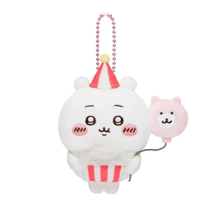 White plush keychain with pink bead necklace, red party hat, and small bear charm