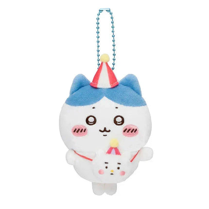 Blue plush keychain with blue bead necklace, red party hat, and striped cupcake body