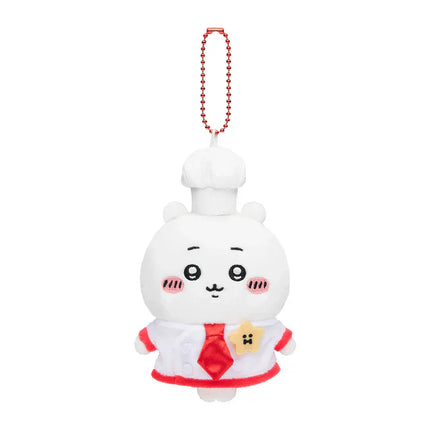 Plush chef mascot keychain with white chef hat, red tie, and bear patch on apron