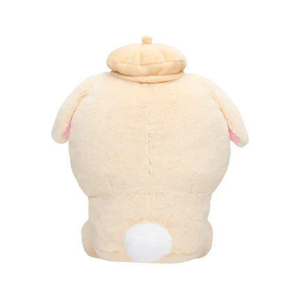 Back-facing beige plush toy with small pom-pom tail and padded cap