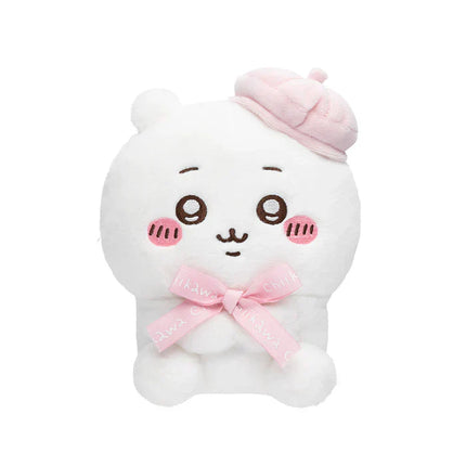 White sitting plush toy with pink bow and pink-trimmed hat