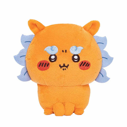 Orange cat-like plush toy with smiling face and blue side tufts.