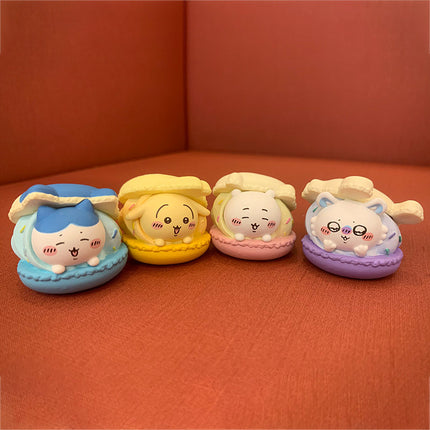 Macaron mascot set of 4 toys in blue, yellow, pink, and purple shells