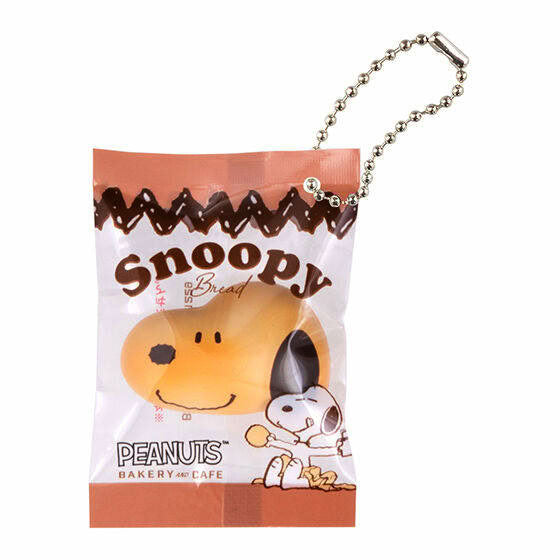 Snoopy bakery cafe charm keychain in a small sealed plastic bag with silver ball chain