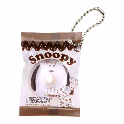 Snoopy bakery cafe charm keychain in a small sealed plastic bag with silver ball chain