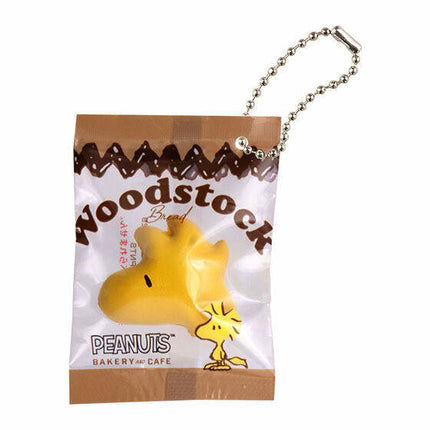 Woodstock bakery cafe charm keychain in a small sealed plastic bag with silver ball chain