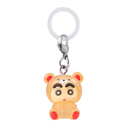 Chibi bear character keychain in yellow-orange pajamas with metal ring and white loop