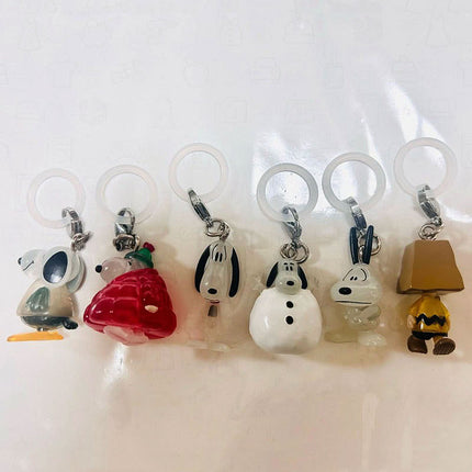 Six character marker charms with key rings: snowman, red figure, rabbit, dog, penguin, lamp.