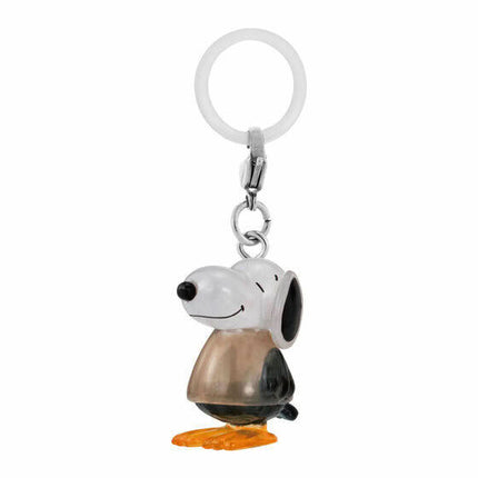 Dog-shaped keychain charm with smiling face and orange base, hanging from ring