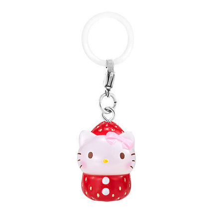 Strawberry-themed cat keychain charm with pink bow, red polka-dot outfit