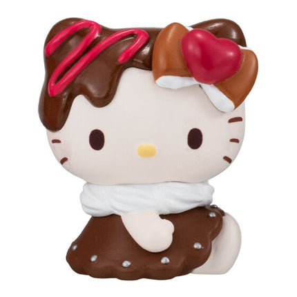 Chocolate cup character doll with white face, brown hat, and pink bow