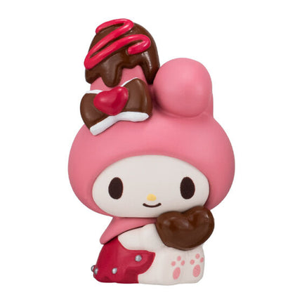 Chocolate cup character doll with pink face, brown hair, and heart in a hand