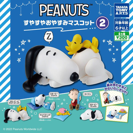Snoopy sleeping figure curled with a yellow chick and light-blue mat on display box