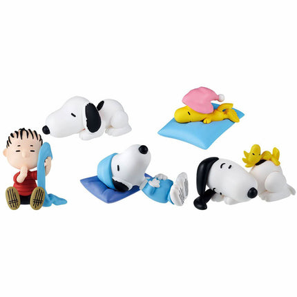 Snoopy sleeping figures set of 5 displayed together on blue and yellow mats