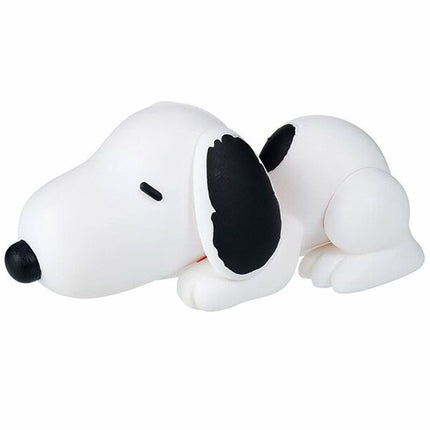 Sleeping Snoopy figure curled on white, with black ear and dark eye patch detail
