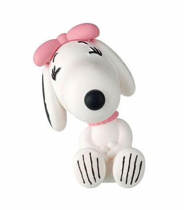 Snoopy capsule toy figure in white with pink bow, lying down