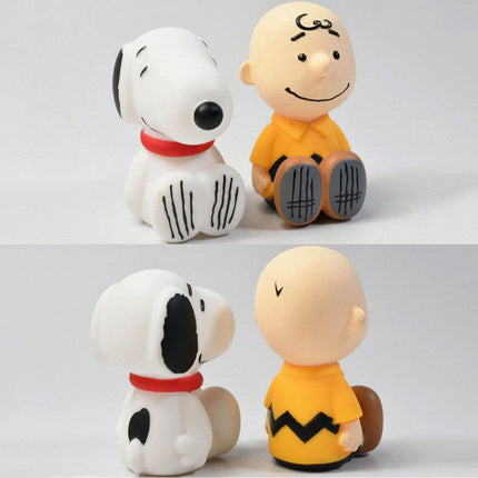 Two-view collage of PEANUTS capsule toy figures: dog and boy, plus back views.
