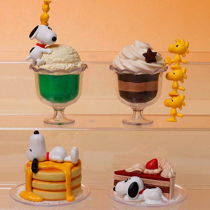 Snoopy dessert capsule figures on stand: green sundae, striped chocolate cup, yellow charms