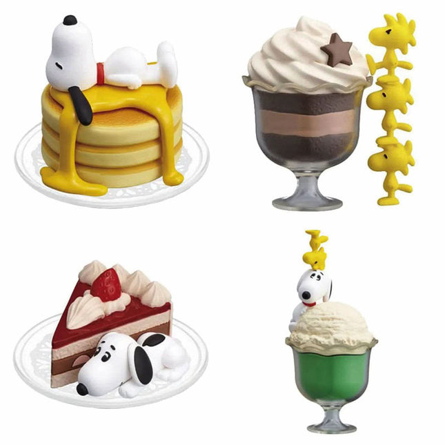 Four Snoopy dessert capsule figures shown together: yellow cake, green cup, chocolate cup, pie slice