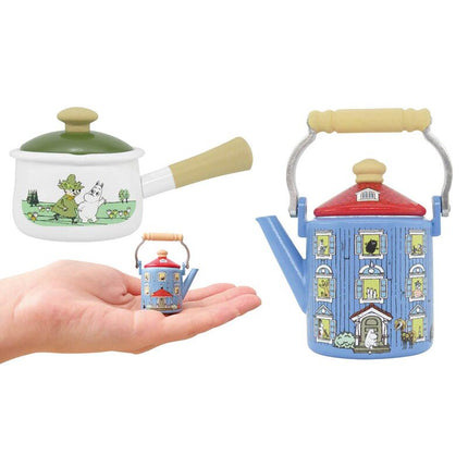 Miniature cookware set: blue house teapot, small teapot, and white saucepan