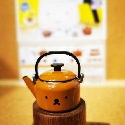 Orange miniature miffy Boris-face kettle with black lid and handle
