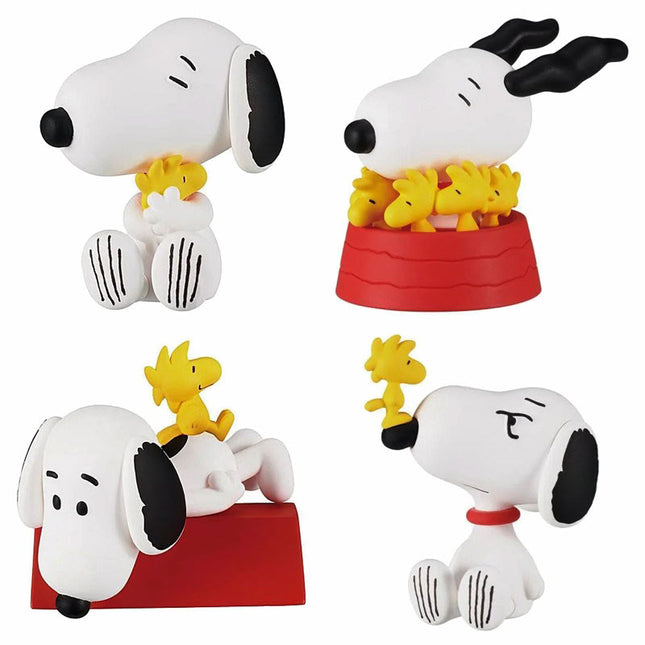 Set of four Snoopy and Woodstock capsule figures with red and white bases