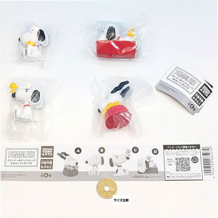 Four Snoopy and Woodstock capsule figures in clear bags with labels