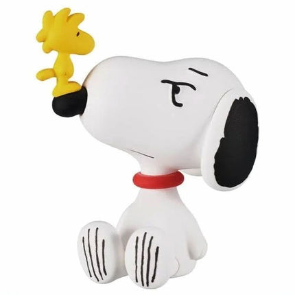 Snoopy figure with yellow Woodstock perched on head, black ears, red collar