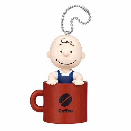 Snoopy face keychain charm on red mug with bead chain