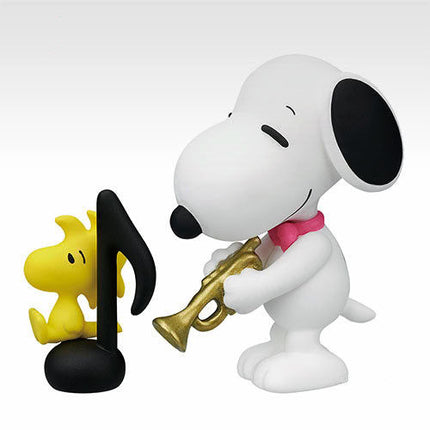 Snoopy trumpet miniature figure with gold horn and yellow flame on black stand
