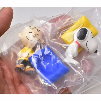 Blister pack containing Snoopy and Charlie Brown capsule mascot figures