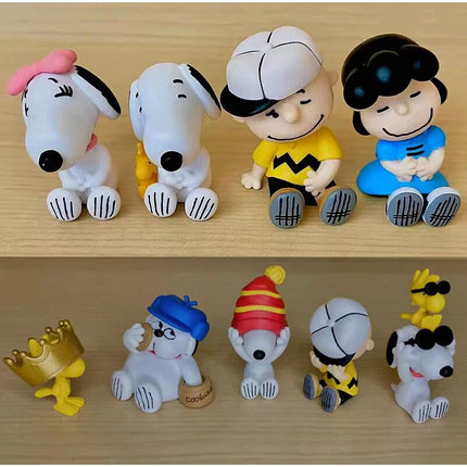 Five Peanuts Snoopy hide-and-seek capsule figures displayed on a wooden surface