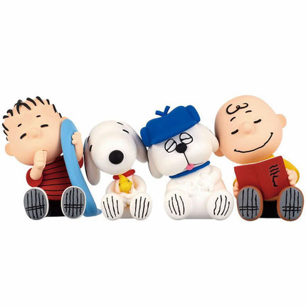 Peanuts capsule toy sleeping figures: Snoopy with blue blanket and Charlie Brown