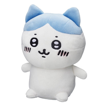 Small white plush cat toy with light-blue ears and smiling face, front view