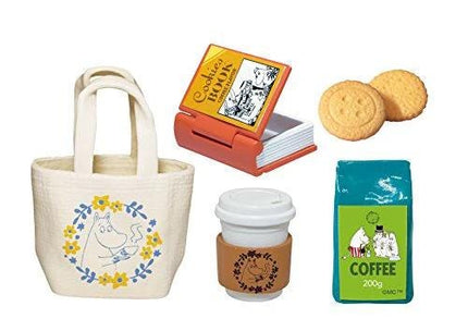 a variety of items, including a white tote bag with a floral design, a book, two cookies, a coffee cup, and a bag of coffee.