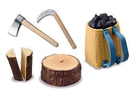 various objects related to outdoor activities, including a wooden axe, a log, a tree stump, and a wicker basket filled with coal.