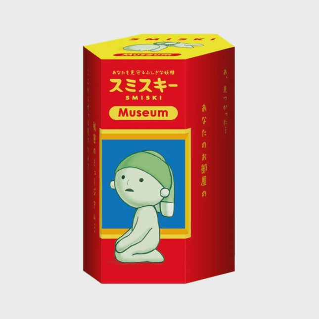 The image is a red and yellow box with a cartoon character on it, and it appears to be a product packaging for a museum.