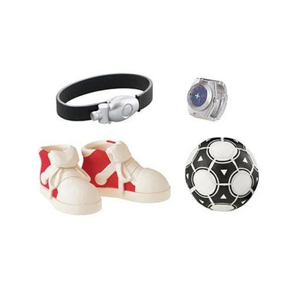 a pair of white and red sneakers, a black watch, a soccer ball, and a black and white bracelet.