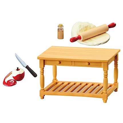 a wooden table with a rolling pin, a knife, and an apple on the table.
