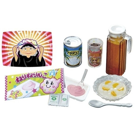 various food and drink items, including a person wearing a hat, a can of soda, a glass of juice, a bowl of fruit, a spoon, and a package of jelly.