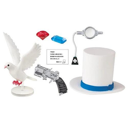 various objects, including a white bird figurine, a top hat, a magnifying glass, and a toy gun.