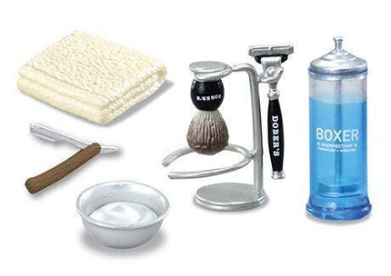 various grooming items, including a shaving brush, a razor, a shaving cream, and a shaving brush holder.
