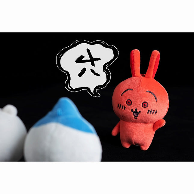 Red rabbit mascot plush with embroidered face and black outline ears